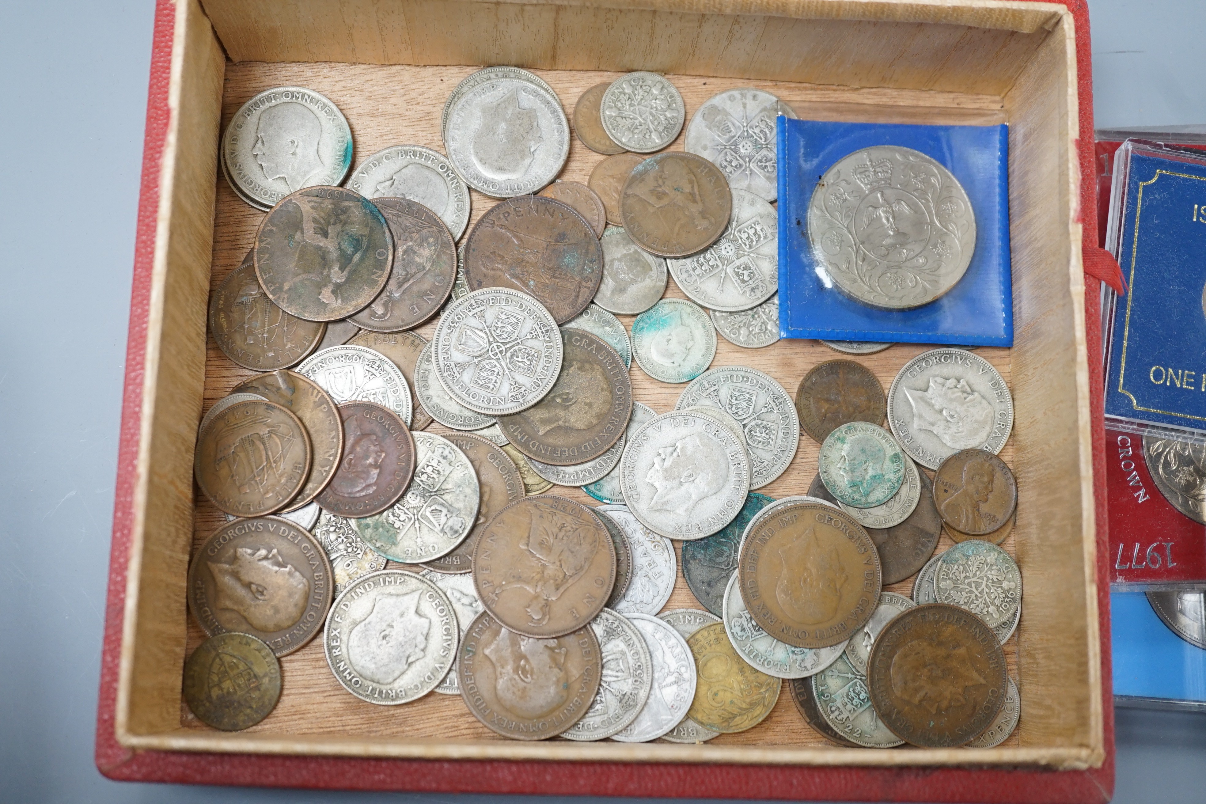 A collection of coins including a Victoria crown and two florins